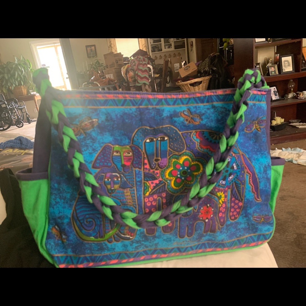 Blue and green handbag with dogs on it